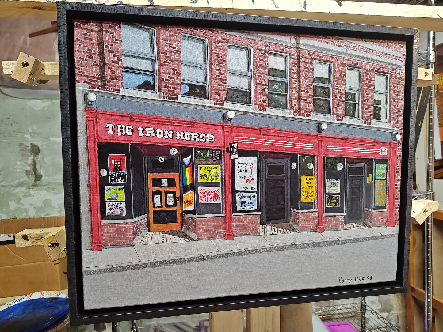Framed artwork of a brick building with a sign reading 'The Iron Horse'.