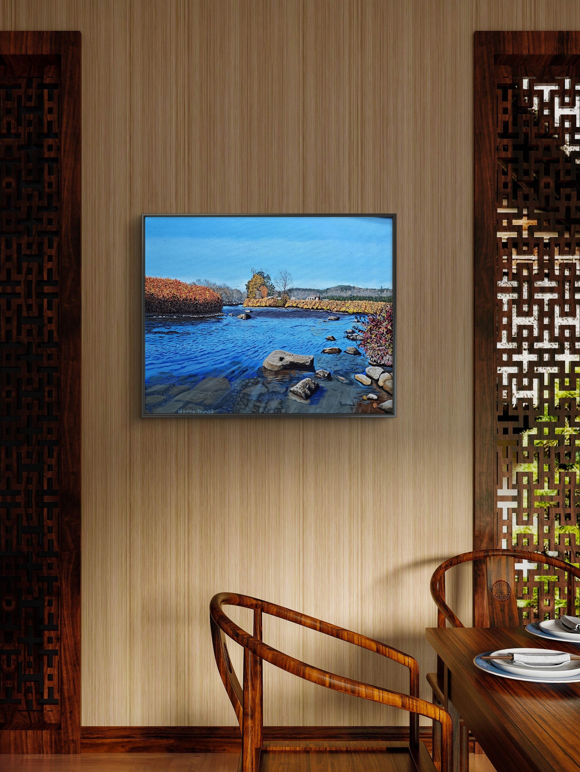 Deerfield River, oil on a 20 x 26 inch canvas. Framed landscape painting on a wall above a wooden table with chairs.